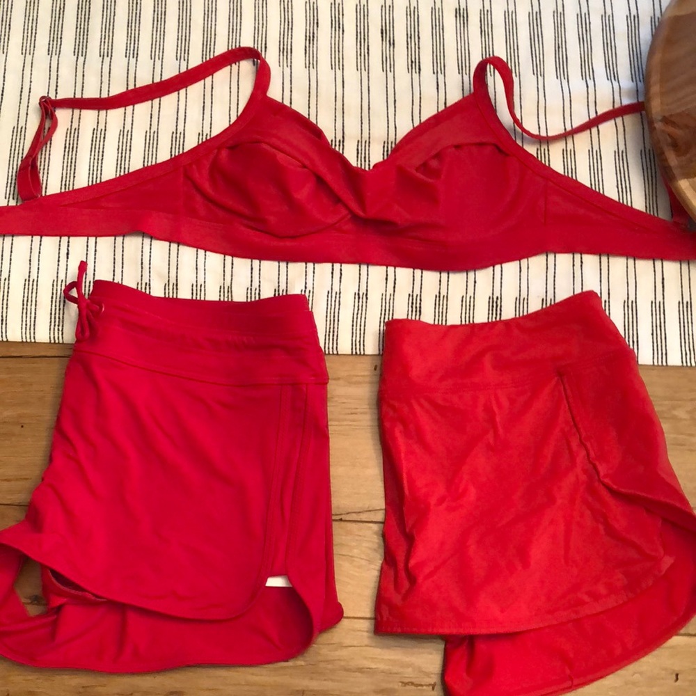 Athleta red swimsuit. Includes top, shorts, skort
